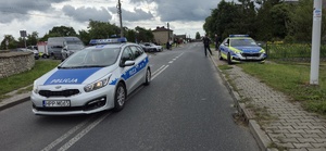 Na zdjęciu policjanci zabezpieczający wyścig